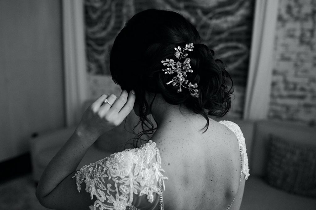 detail shot of brides hairpiece on her wedding day at the Cadillac service garage in Greensboro North Carolina