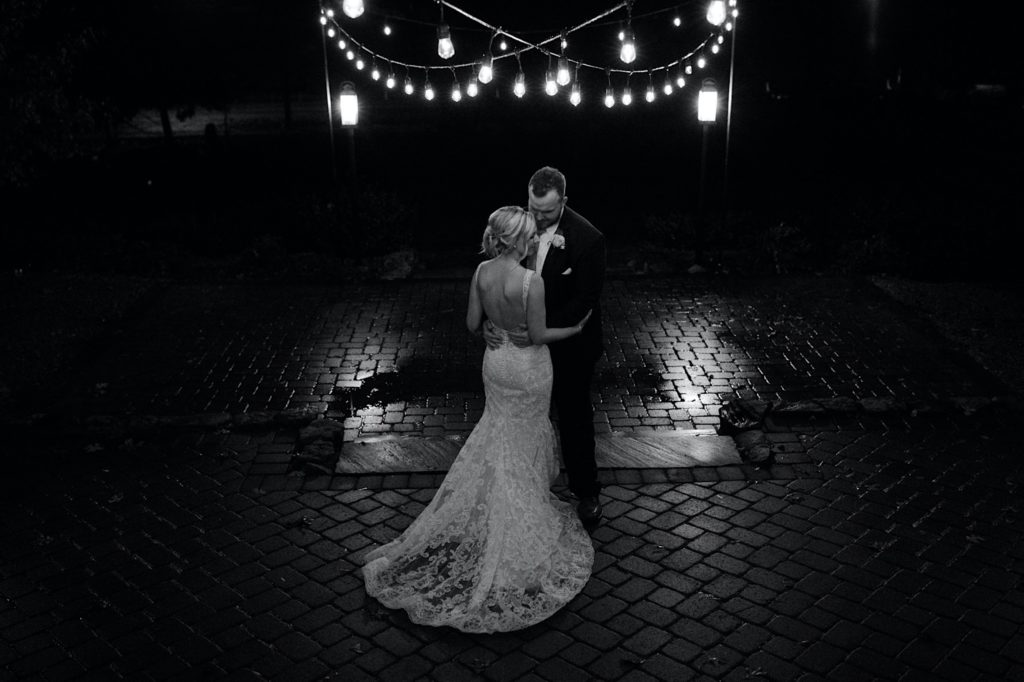 black and white photo of bride and groom at ritchie hill in the fall